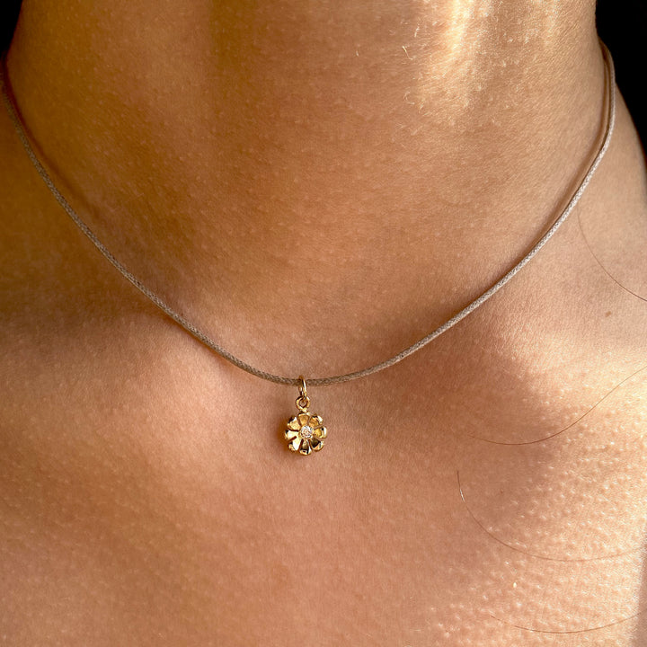Gold & Ruby Daisy Charm